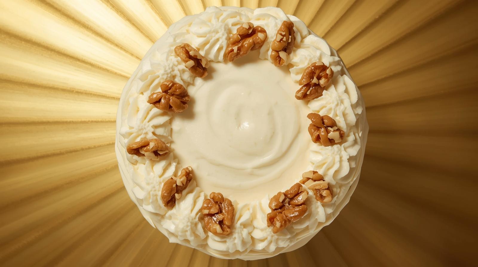 Menu full-carrot-and-walnut-cake-with-icing-around-with-shiny-gold-background-1